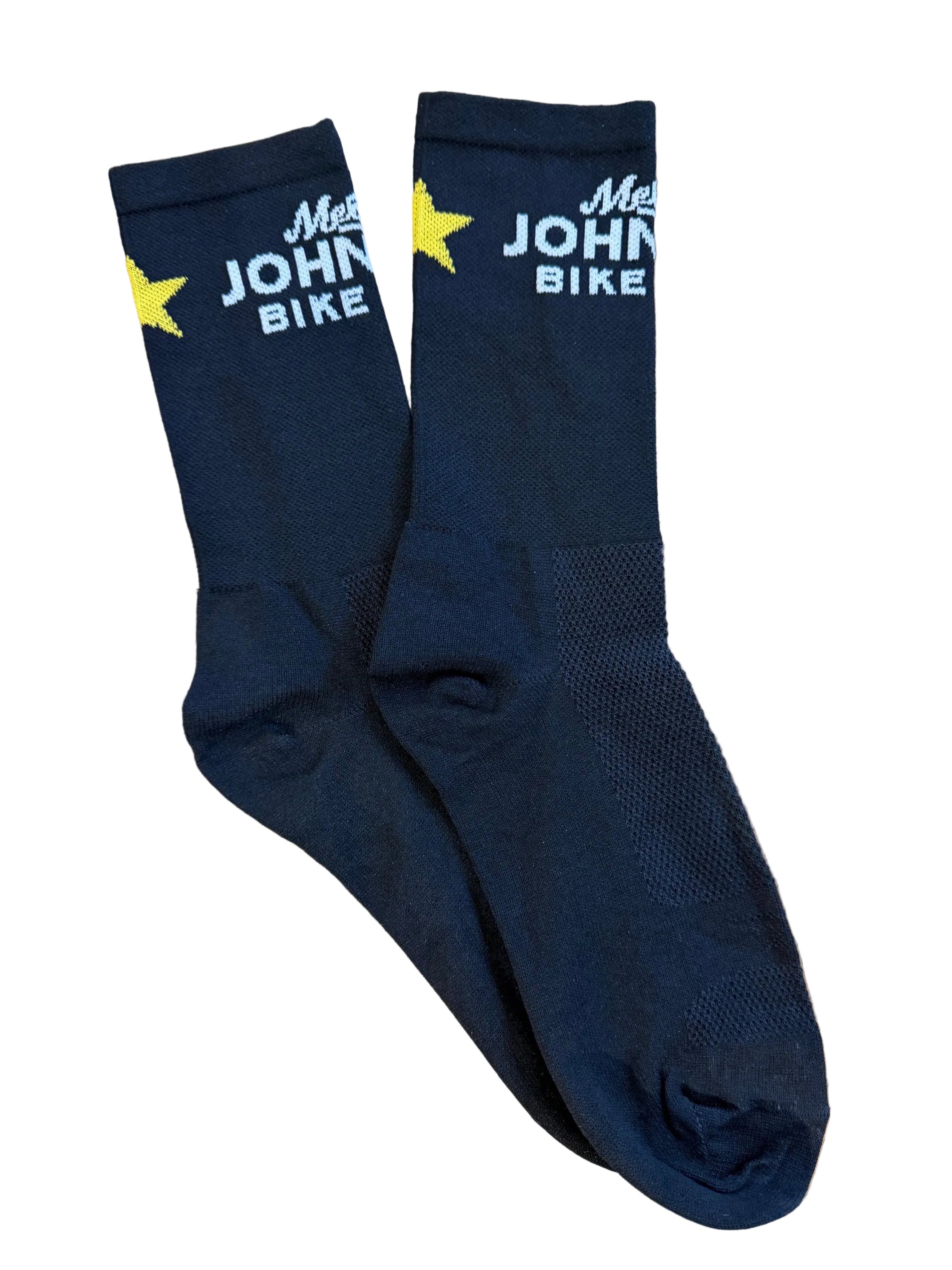 A pair of black crew socks laid flat on a white background, featuring 'Mellow Johnn's Bike Shop' in white text and a yellow star logo near the c